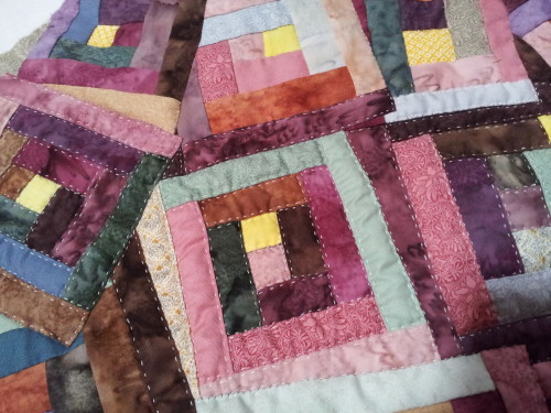 Close up showing the hand quilting around each 