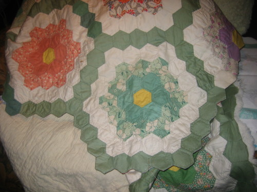 quilting around the tiny hexagons I have just added to back of the quilt as a bindingbinding