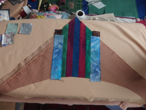 My centre is very ehavy due to all the extra seams  I have because of using up  old blocks for my circle shapes.  So I needed to make my corners heavy also to cope with the weight in the centre.  I cut out 4 corners from a good weight fabric then started sewing  1 1/2 inch strips 