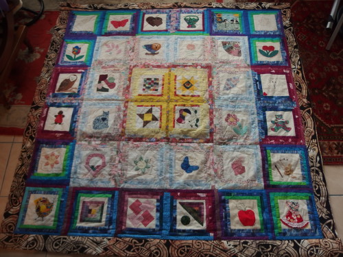 Papua New Guinea friend ship quilt we made these nearlly 20 years ago and Im just getting around to quilting it. As its all in blocks Im machine quilting it in the ditch,  sewing machines and I dont go together because I have a bad back so Im doing one or two runs a day, another few weeks and it will be done I hope. 