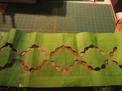 Here you can see the strong contrast where I have placed the template over my pink silk panel.  then I took a fine chalk marker and carefully marked only the ends of the ovals 