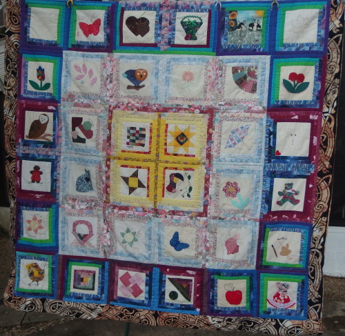 Friendship quilt hanging out for some fresh air, Im about 1/2 way with the quilting. 