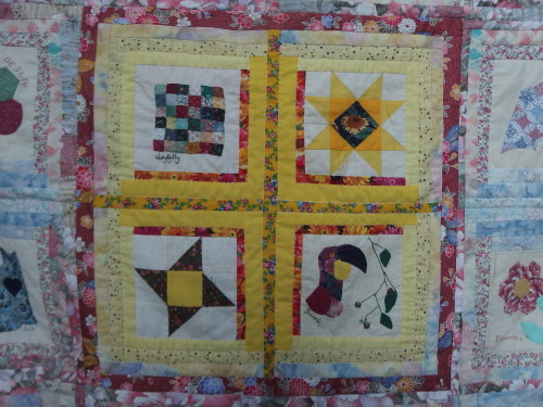 Centre almost finished quilting. I used tags to sandwich this quilt and it stood up to the pulling out and putting away over several years but I did notice a few we pull tension holes in the fabric. I still like basting my quilts with thread there is NO tension on them with thread. 