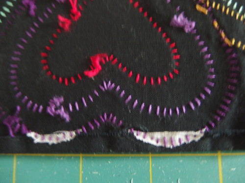 Here you can just see some of the mauve strip I have cut around the apploqie hopeing to solve the 