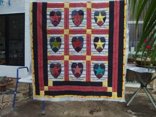 There is another row to the quilt but it is hanging over the back of the line??????