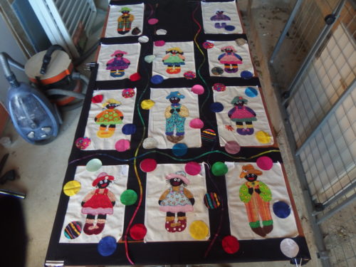 Im not going to add Mummer Golly that I made here as it did not balance and I wanted to use every one of these a dorable blocks, I will make a cover for the quilt to go in and use Mumma on the cover. So Im leaving the top centre black black and will fill it with Balloons. 