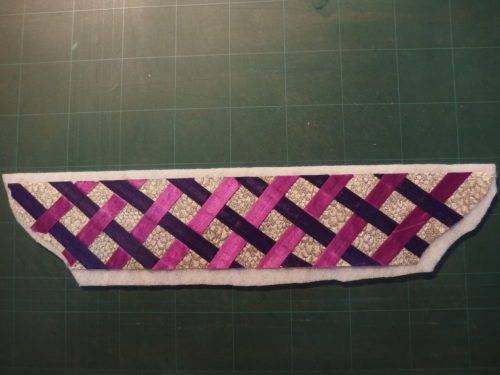 Ironed on to some batting before I quilt all those strips in place I want a 3D look as it looked rather flat. 