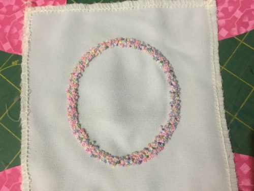 Working an O in colonial knots and French knots! 